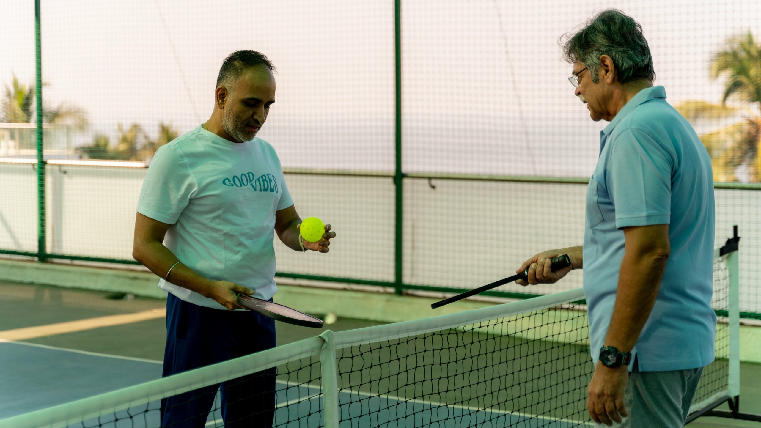 A coach explaining how to play a pickleball