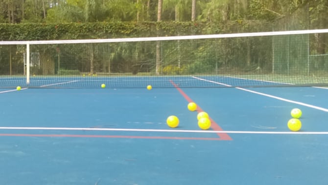 Pickleballs on court