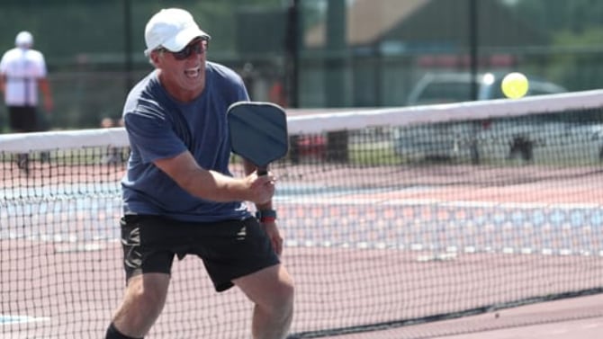 senior playing pickleball